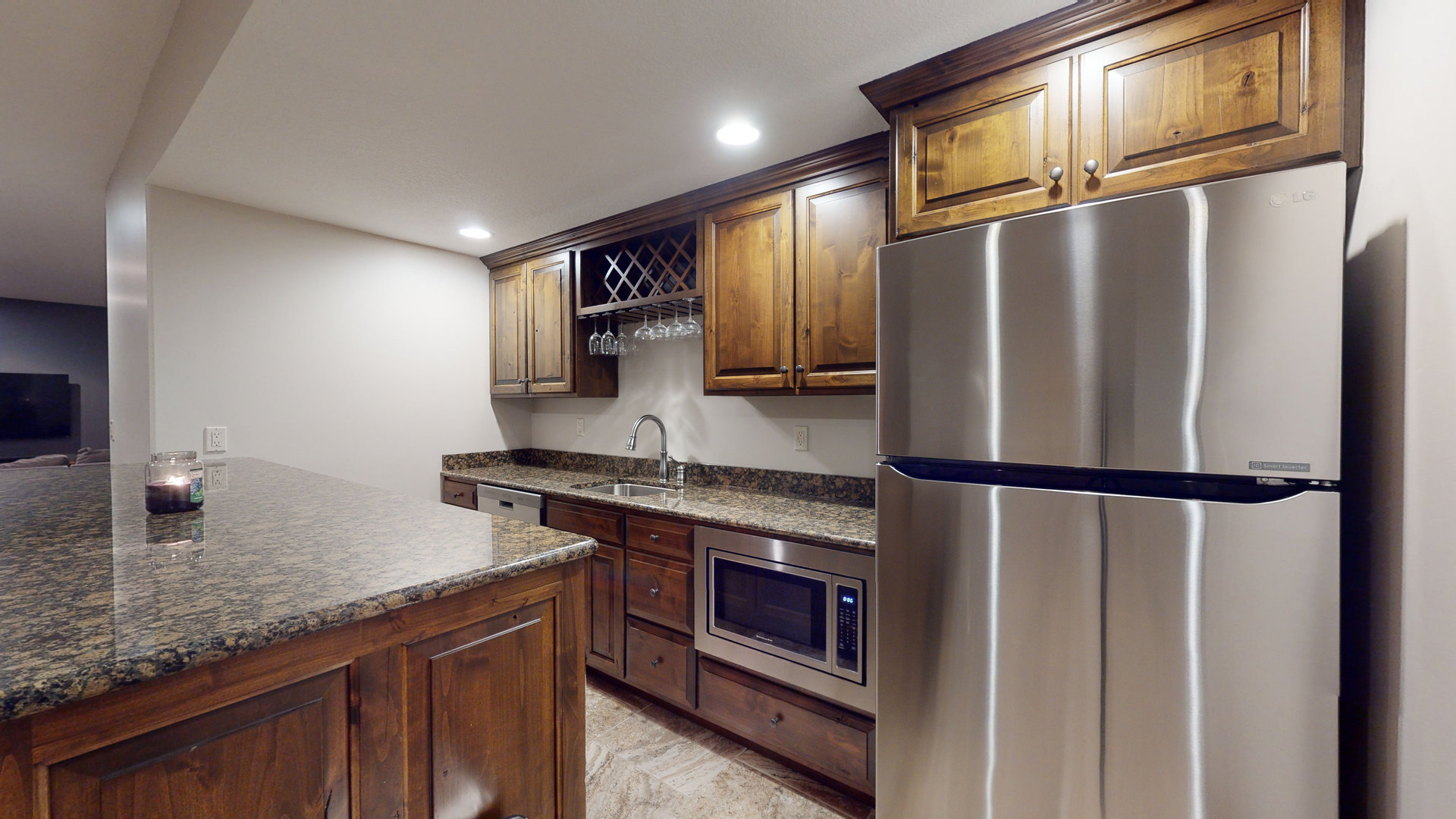 1303 East White Oak Road Mahomet, IL 61853 - Photo 37 of 64 a kitchen with stainless steel appliances granite countertop a refrigerator a stove and a sink with wooden floor