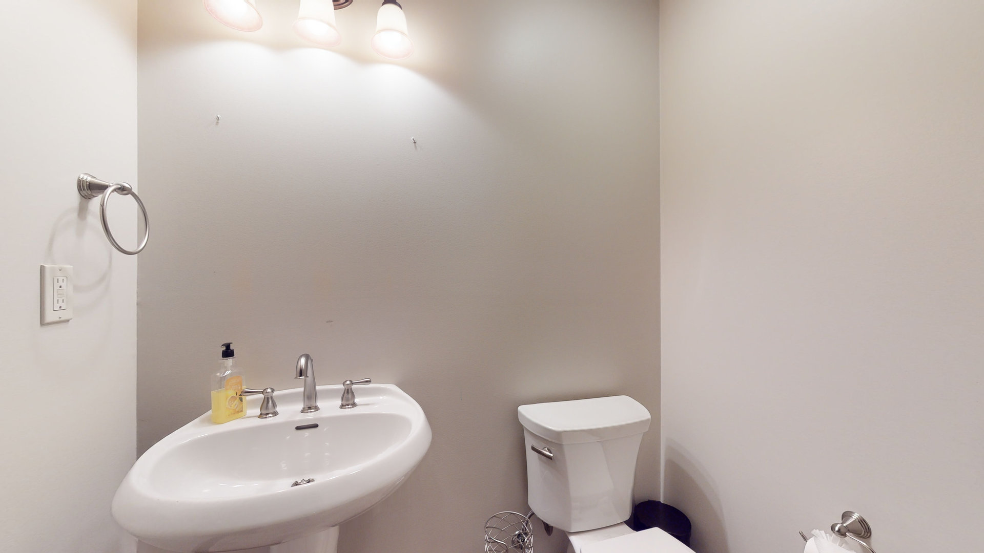 1303 East White Oak Road Mahomet, IL 61853 - Photo 42 of 64 a bathroom with a toilet a sink and mirror