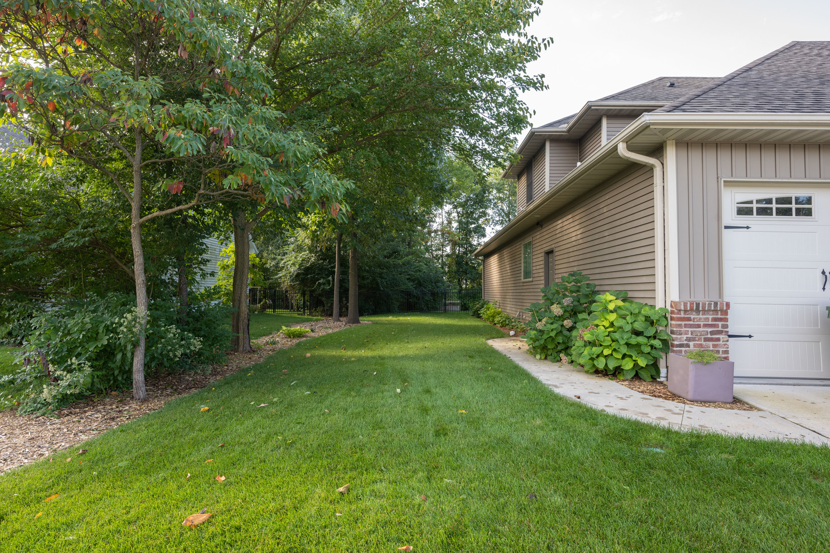 1303 East White Oak Road Mahomet, IL 61853 - Photo 50 of 64 a view of a house with a yard