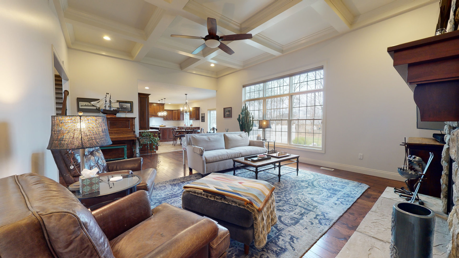 1303 East White Oak Road Mahomet, IL 61853 - Photo 5 of 64 a living room with furniture a flat screen tv and a window