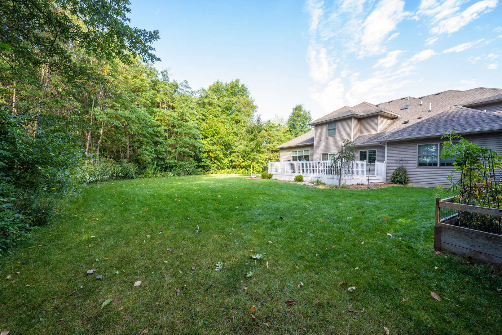 1303 East White Oak Road Mahomet, IL 61853 - Photo 56 of 64 a view of a house with a big yard plants and large tree