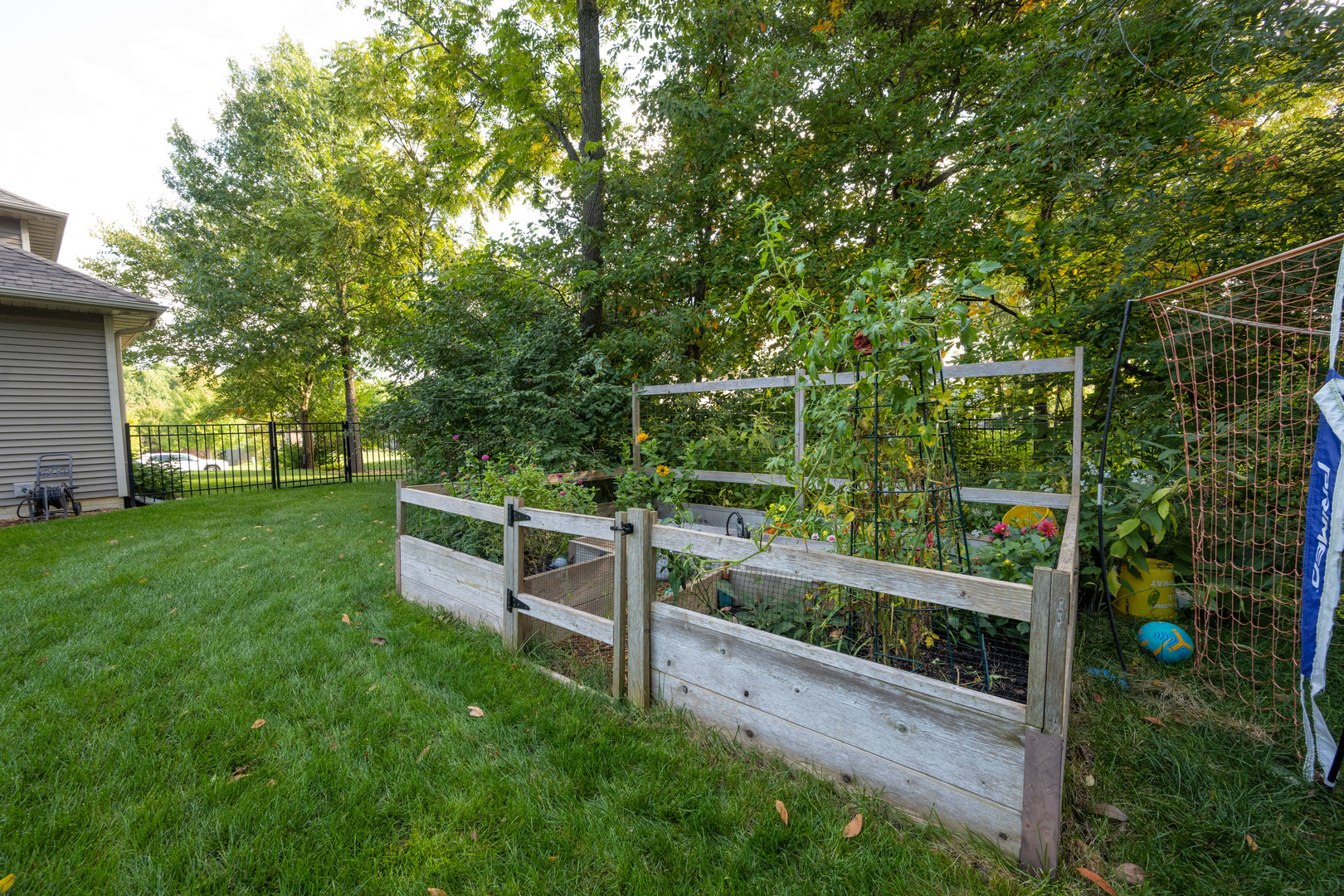 1303 East White Oak Road Mahomet, IL 61853 - Photo 58 of 64 a view of a wooden fence and trees in the background