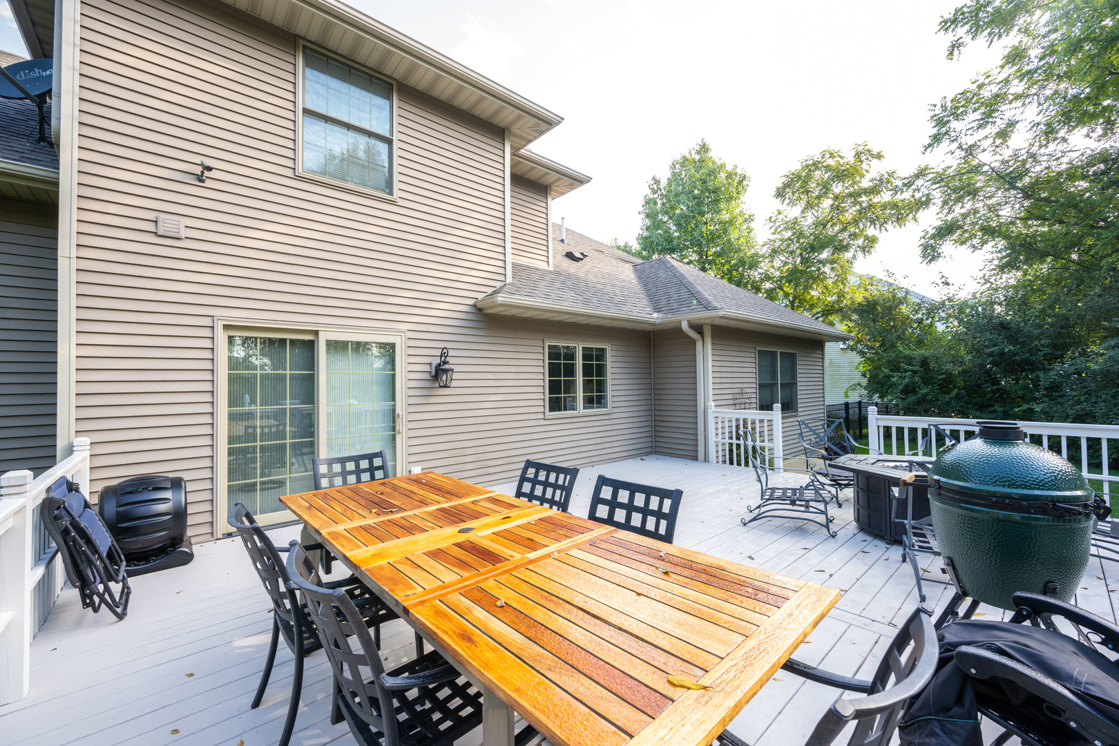 1303 East White Oak Road Mahomet, IL 61853 - Photo 62 of 64 a view of a patio with table and chairs with wooden floor and fence