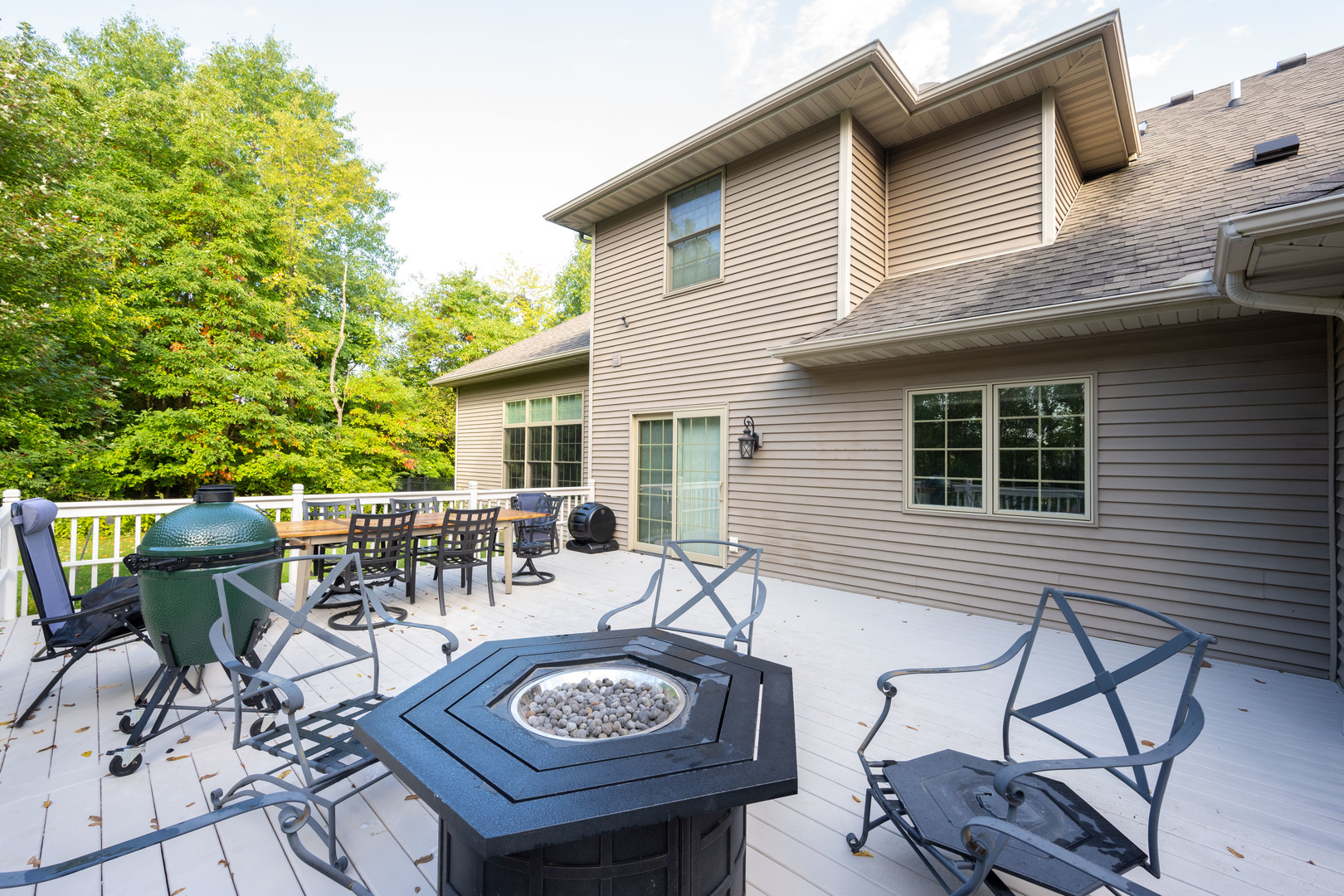 1303 East White Oak Road Mahomet, IL 61853 - Photo 63 of 64 a view of a patio with table and chairs and potted plants
