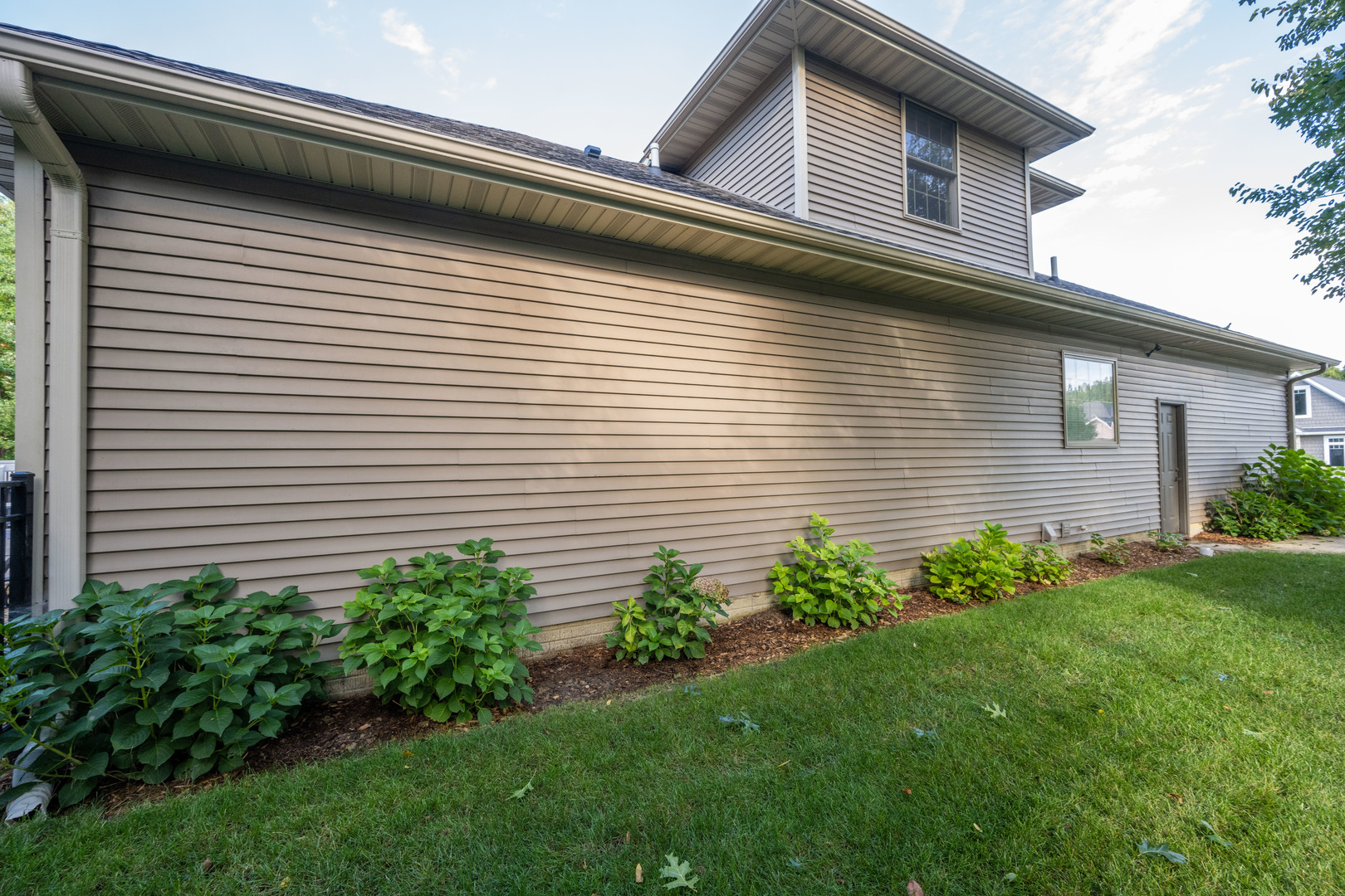 1303 East White Oak Road Mahomet, IL 61853 - Photo 64 of 64 a view of a house with a yard potted plants