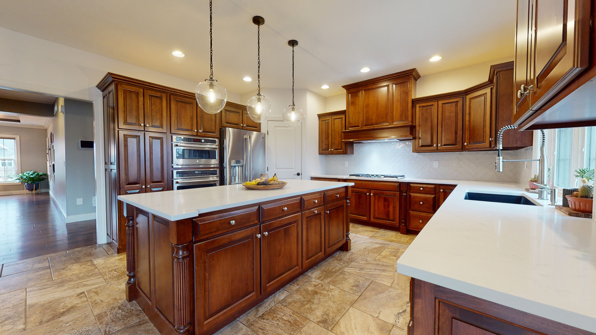 1303 East White Oak Road Mahomet, IL 61853 - Photo 9 of 64 a kitchen with stainless steel appliances granite countertop a sink a stove and a wooden floors