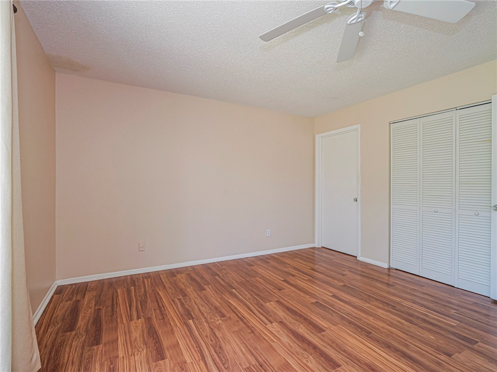 110 Spring Lake Court, Unit 102 Vero Beach, FL 32962 - Photo 15 of 33 a view of room with wooden floor