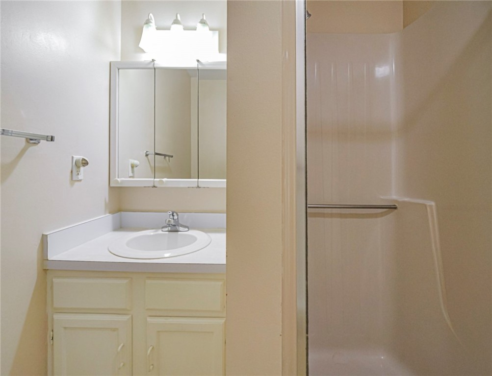 110 Spring Lake Court, Unit 102 Vero Beach, FL 32962 - Photo 19 of 33 a bathroom with a sink and a mirror