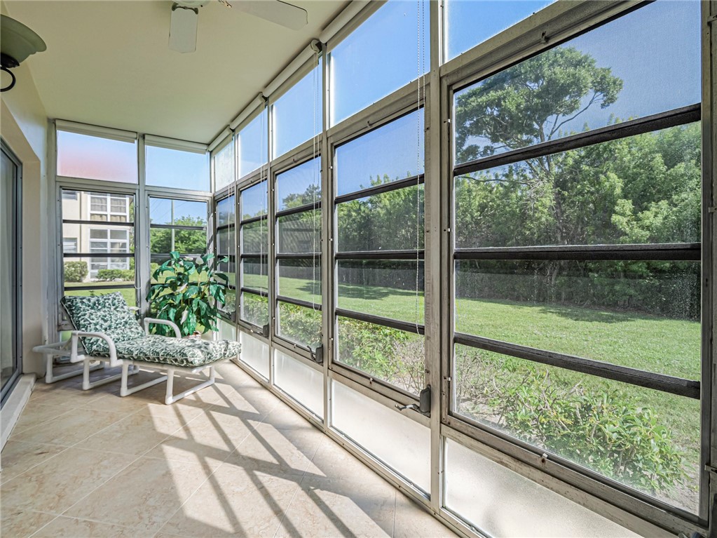 110 Spring Lake Court, Unit 102 Vero Beach, FL 32962 - Photo 28 of 33 a view of a house with a porch