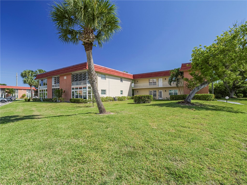 110 Spring Lake Court, Unit 102 Vero Beach, FL 32962 - Photo 33 of 33 a house view with garden space