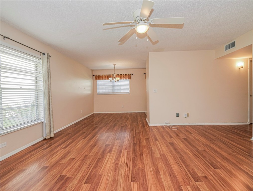 110 Spring Lake Court, Unit 102 Vero Beach, FL 32962 - Photo 8 of 33 wooden floor in an empty room with a window
