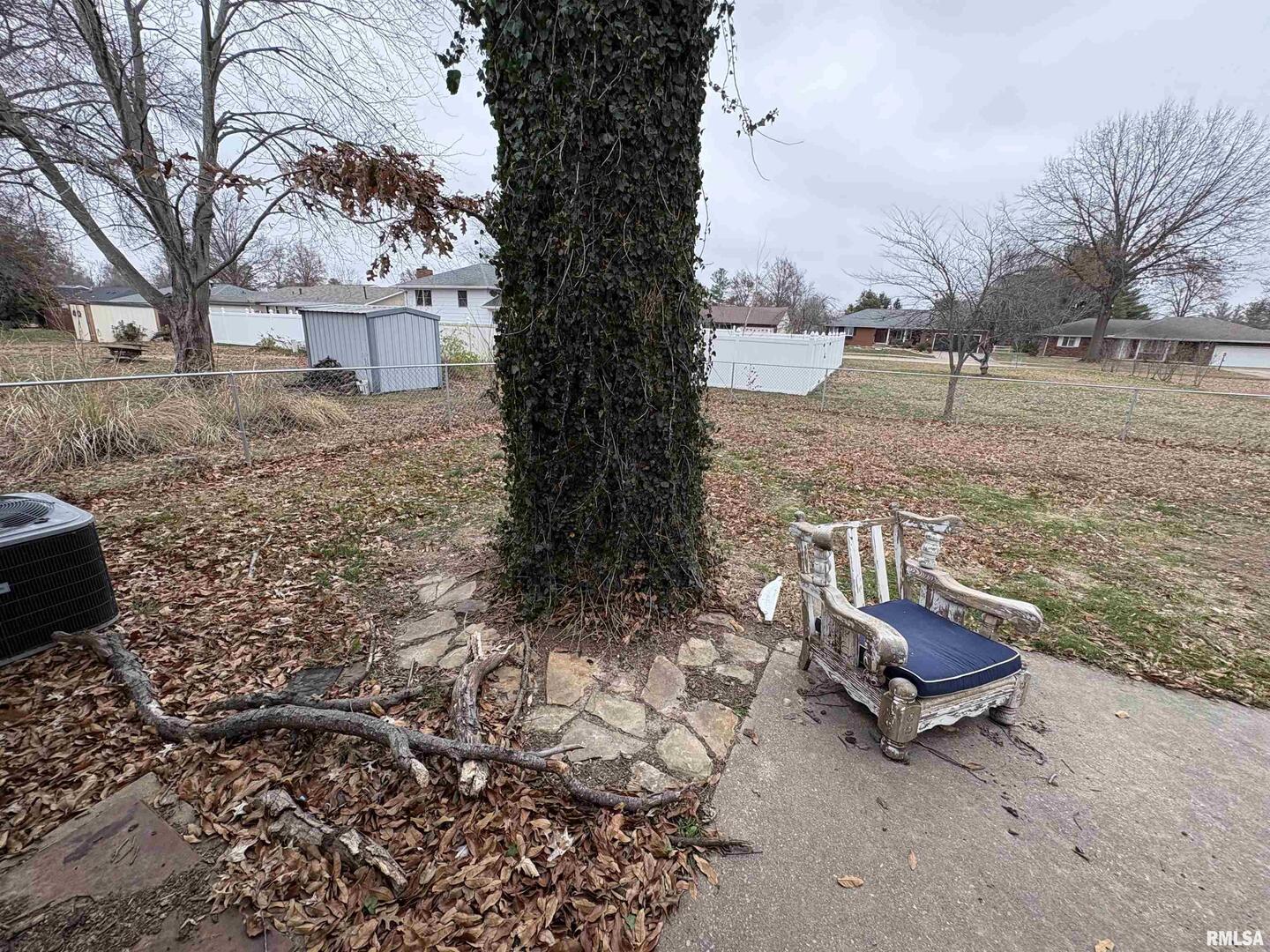 623 Meadowbrook Lane Centralia, IL 62801 - Photo 16 of 16 a bench sitting in the middle of a yard