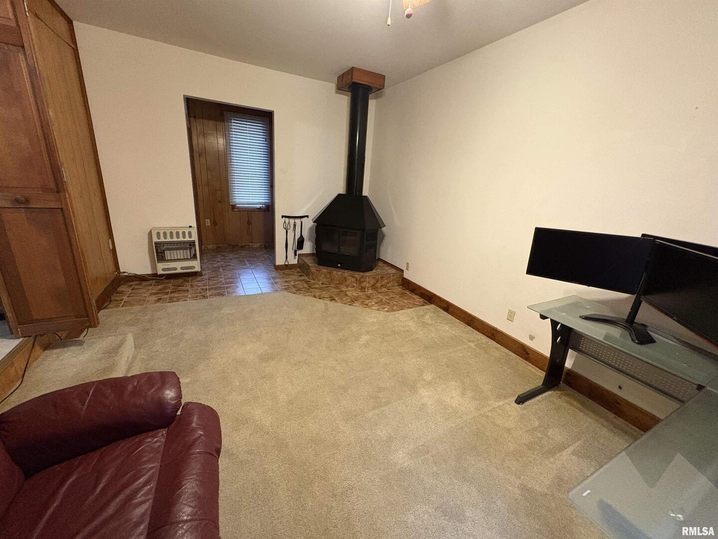 623 Meadowbrook Lane Centralia, IL 62801 - Photo 4 of 16 a bedroom with a bed and a chair