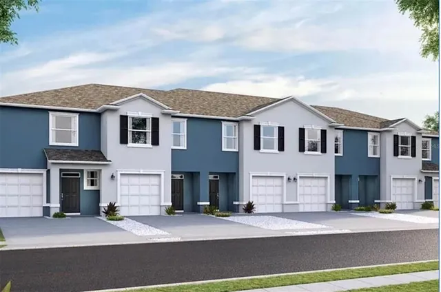 a front view of a house with a garage