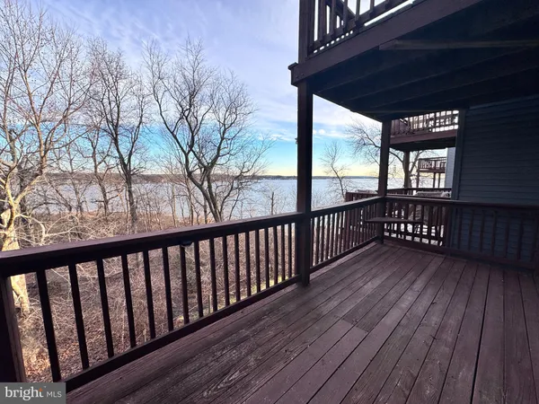 a view of a pathway with a wrought fence
