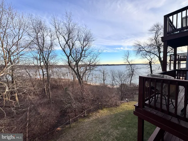a view of a pathway with a wrought fence