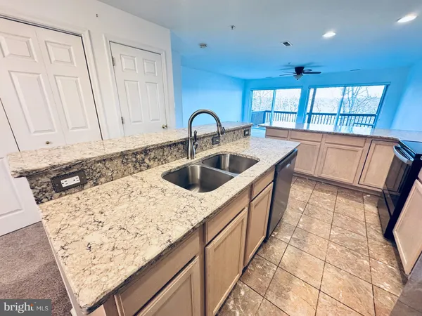 a view of a kitchen and a sink