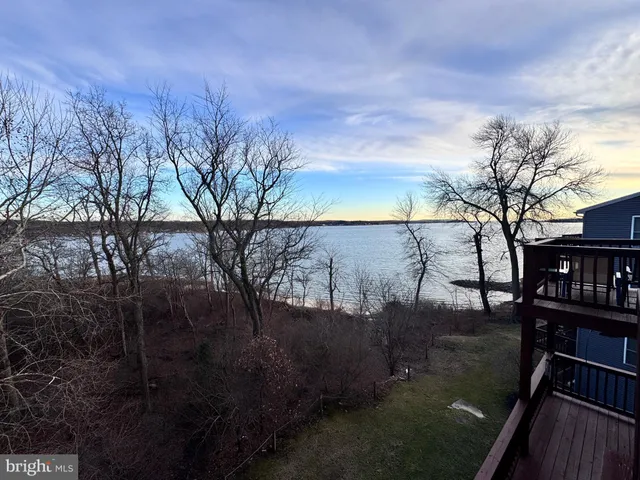 a bathroom with a double vanity sink toilet and shower