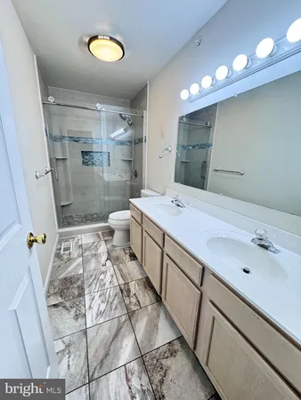 an empty room with a ceiling fan and window