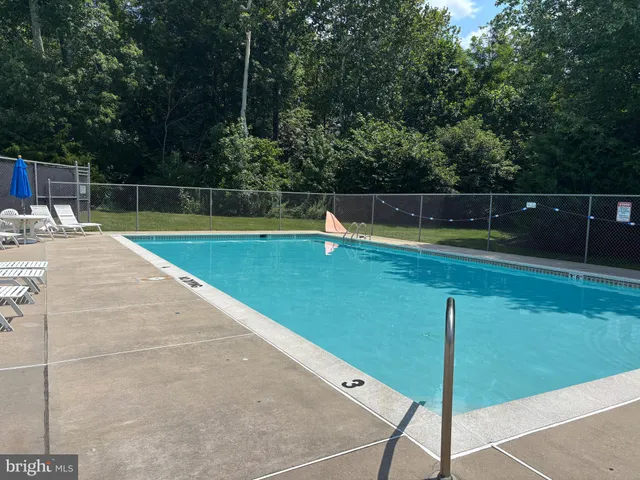 a view of staircase with white walls