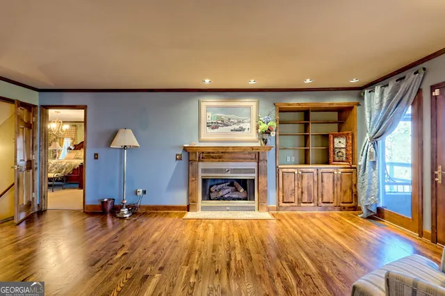a living room with furniture window and wooden floor