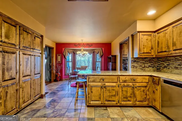 a view of a kitchen and dining area