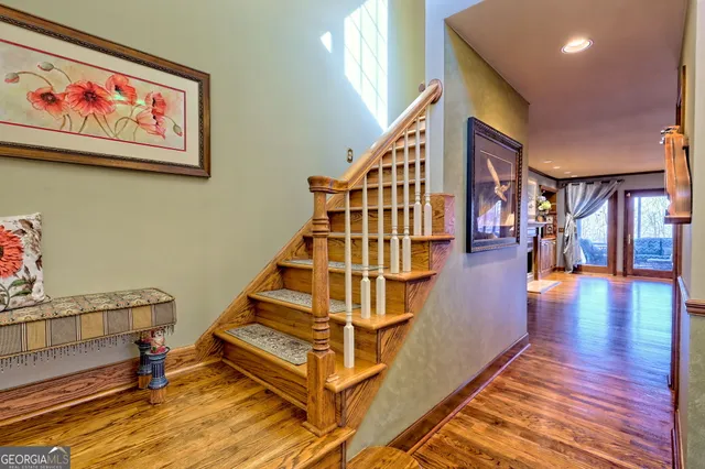 a bathroom with a sink mirror vanity and toilet