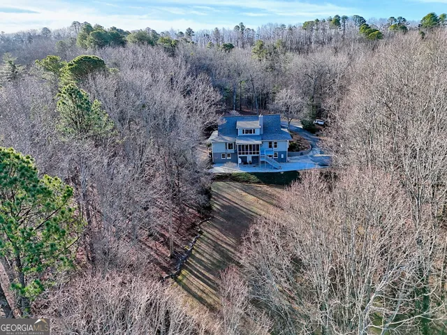 a view of house with backyard space