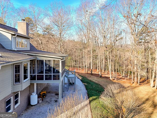a view of a house with a yard and garage
