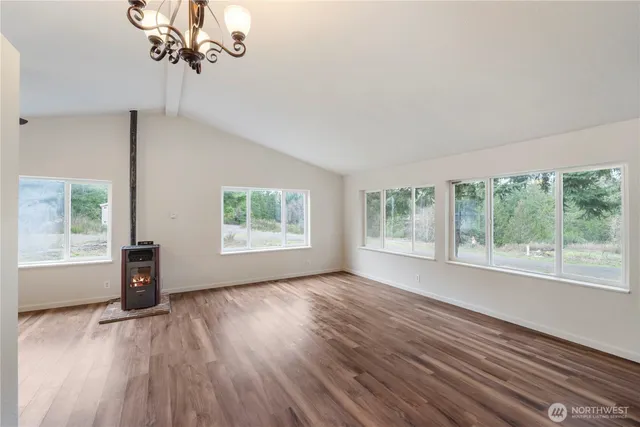 a spacious bathroom with a granite countertop sink toilet and shower
