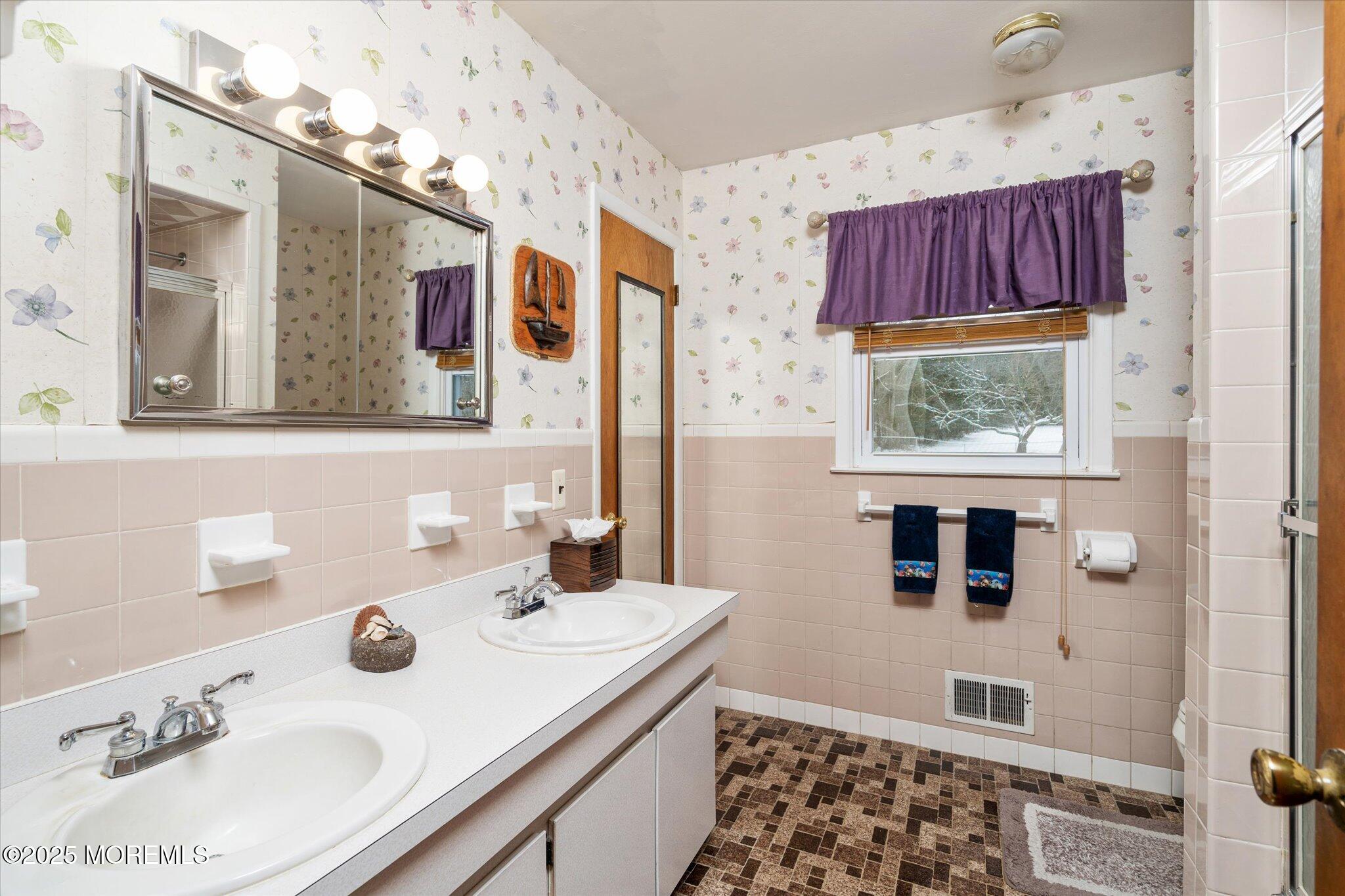 90 Valley Road Jackson, NJ 08527 - Photo 15 of 44 a bathroom with a sink and a mirror