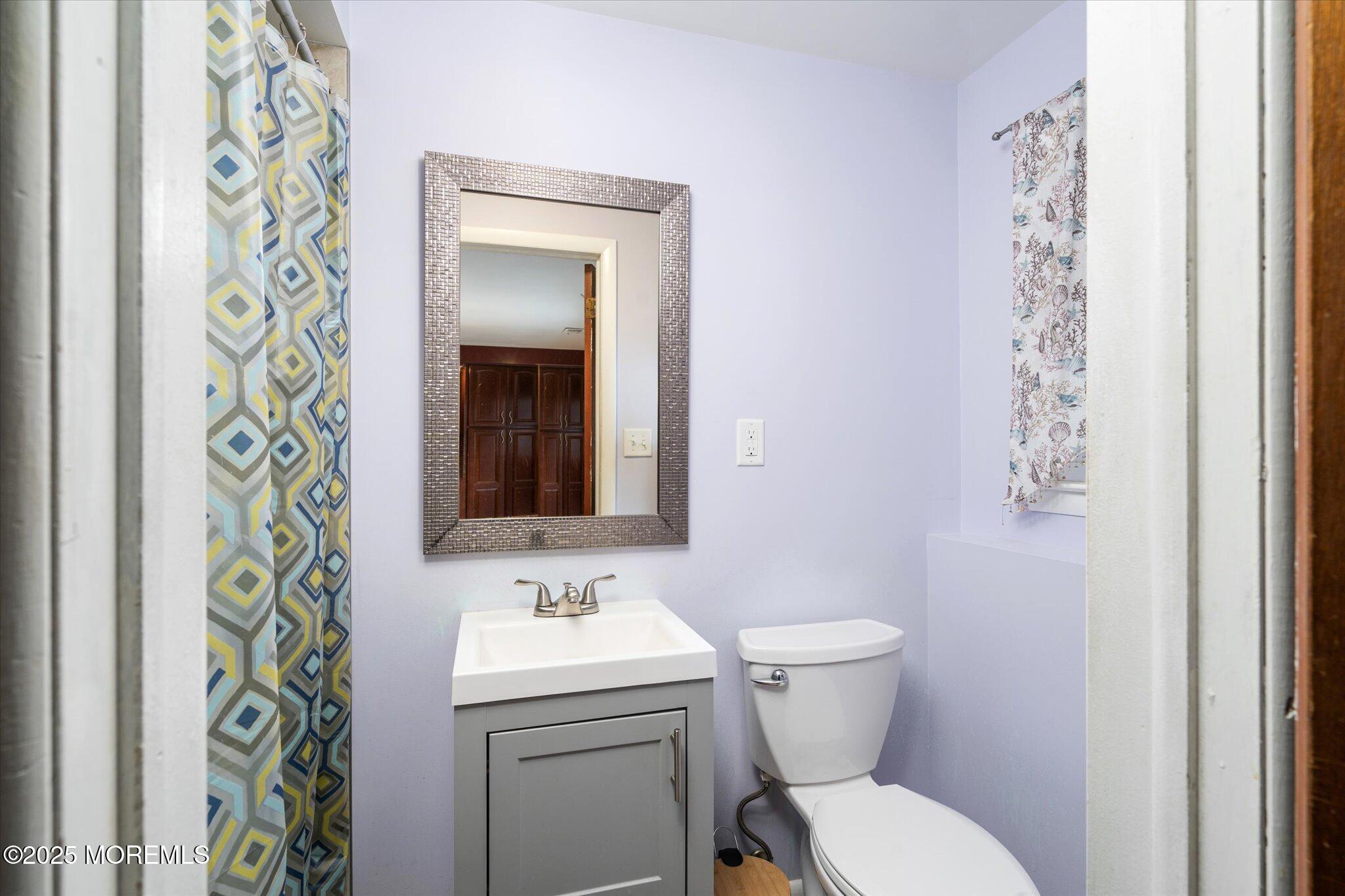 90 Valley Road Jackson, NJ 08527 - Photo 25 of 44 a bathroom with a toilet sink and mirror
