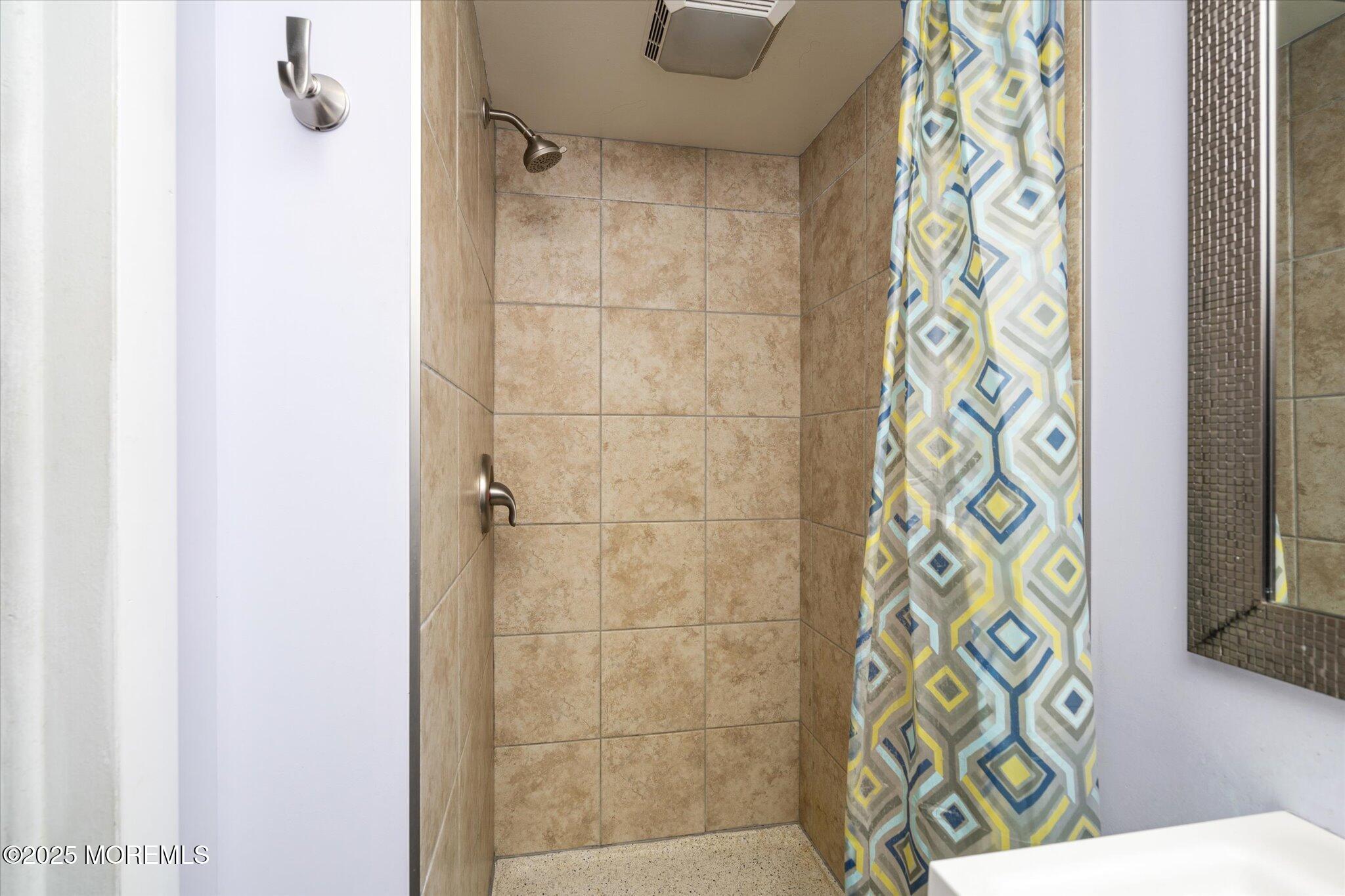 90 Valley Road Jackson, NJ 08527 - Photo 26 of 44 a bathroom with a shower and a window
