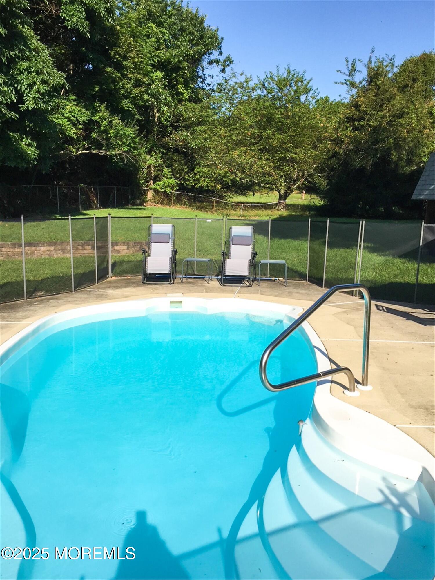 90 Valley Road Jackson, NJ 08527 - Photo 40 of 44 a swimming pool with some trees in the background