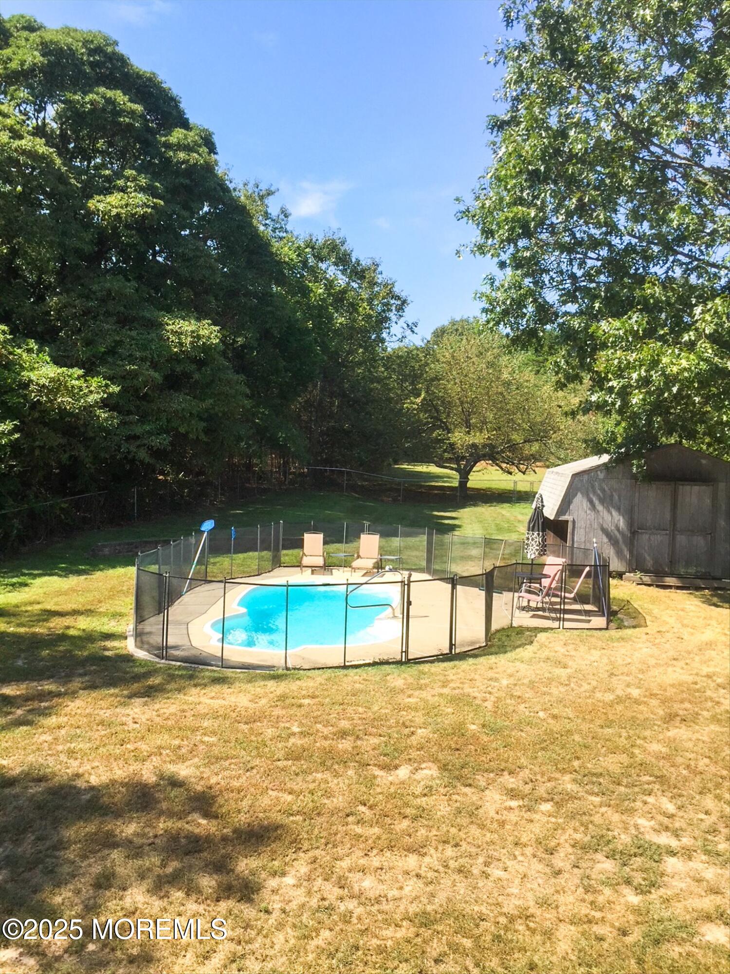 90 Valley Road Jackson, NJ 08527 - Photo 41 of 44 a view of a swimming pool with an outdoor space