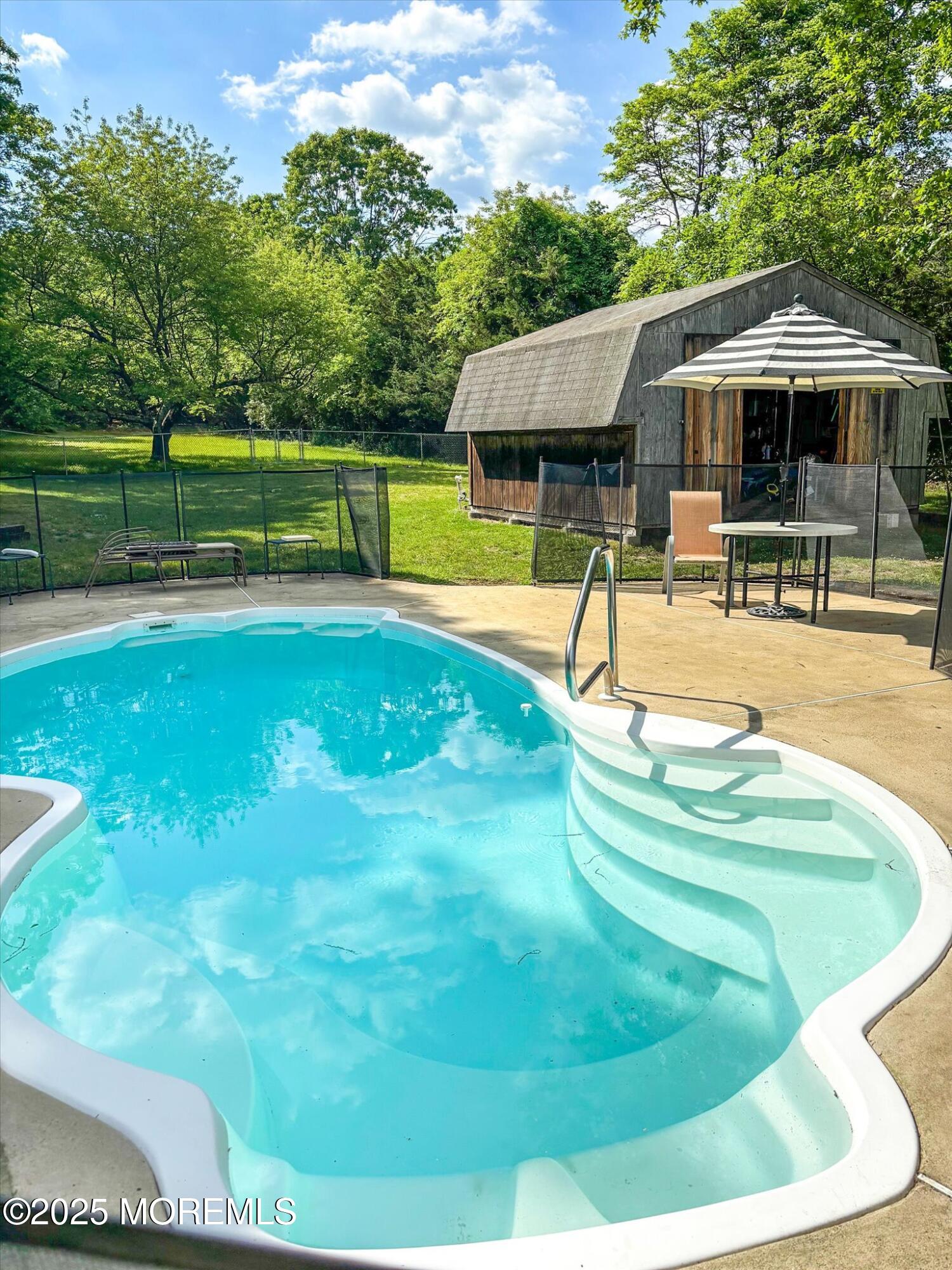 90 Valley Road Jackson, NJ 08527 - Photo 44 of 44 a swimming pool with outdoor seating yard and barbeque oven