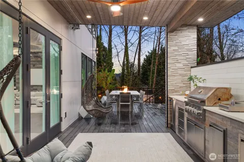a dining room with furniture and wooden floor