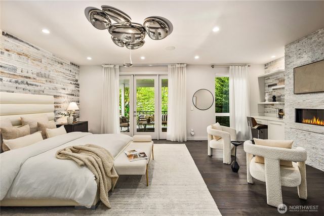 a living room with furniture fireplace and flat screen tv