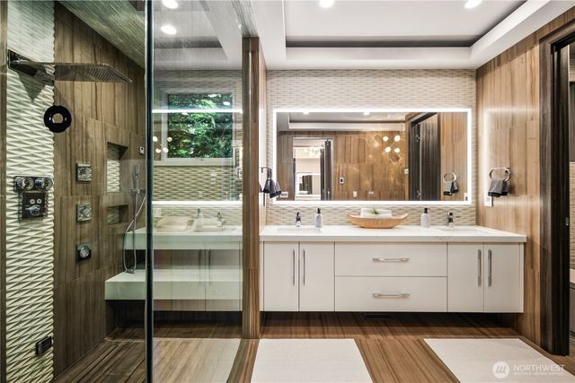 a bathroom with a double vanity sink and mirror