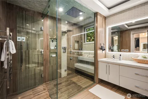 a bathroom with a double vanity sink and mirror