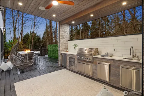 a kitchen with stainless steel appliances kitchen island granite countertop a sink and cabinets