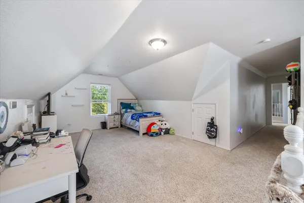 a bathroom with a granite countertop sink a toilet and shower