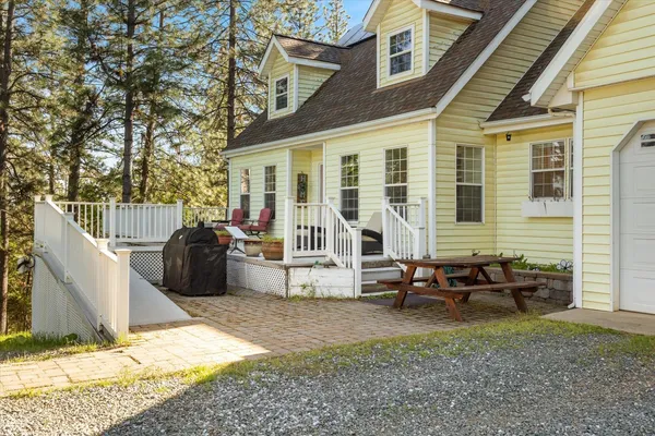 a view of a house with a yard and garage