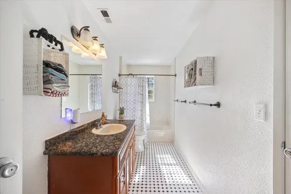 a bed room with a bed and a window