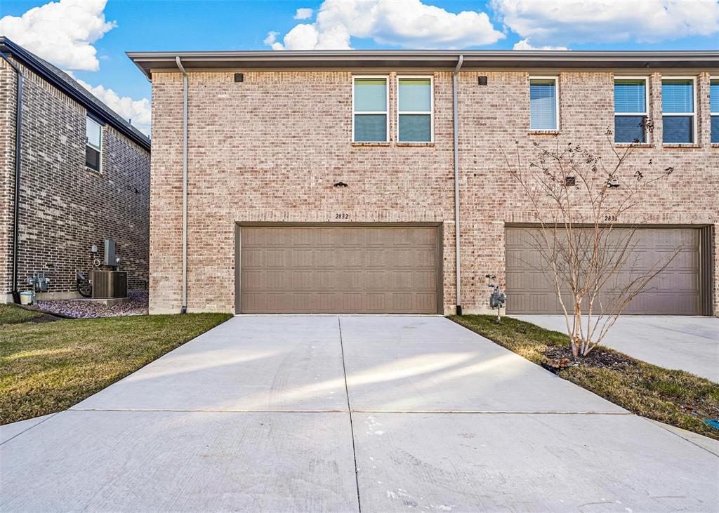 2640 Bluejack Road McKinney, TX 75071 - Photo 2 of 18 a front view of a house with a yard and garage