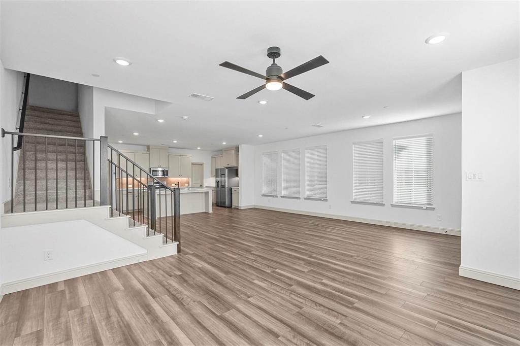 2640 Bluejack Road McKinney, TX 75071 - Photo 4 of 18 a view of a livingroom with wooden floor