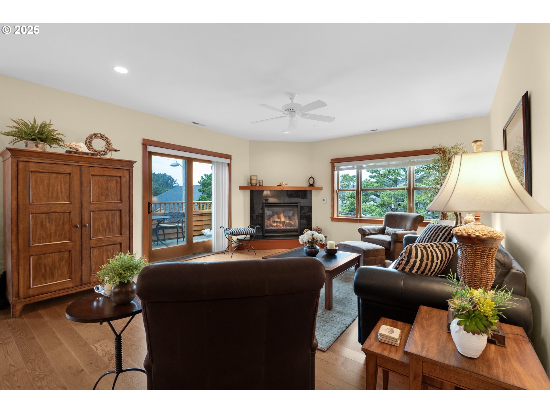 123 South Hemlock Street, Unit 201 Cannon Beach, OR 97110 - Photo 13 of 48 a living room with fireplace furniture and a large window