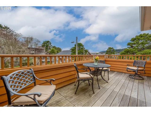 a view of a chairs and table in patio