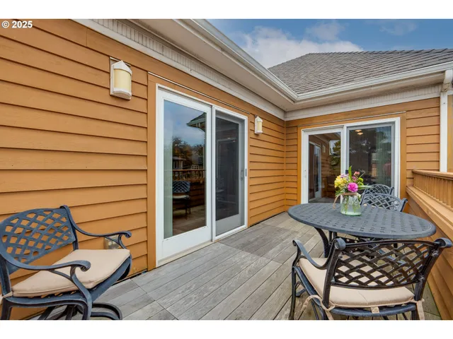 a living room with a bed furniture and a window
