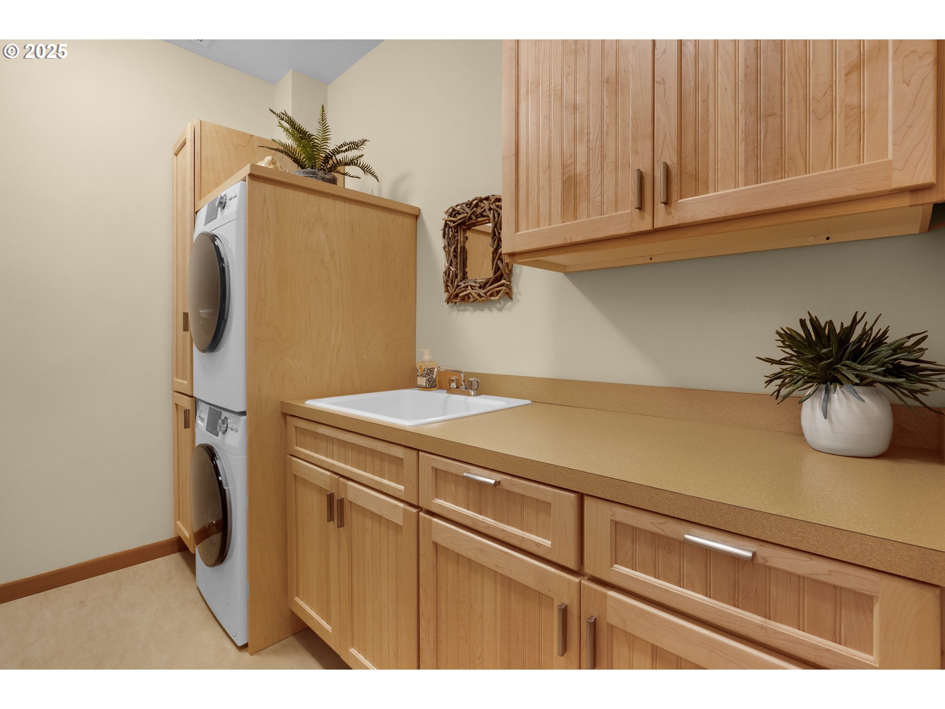123 South Hemlock Street, Unit 201 Cannon Beach, OR 97110 - Photo 41 of 48 a kitchen with a sink and cabinets